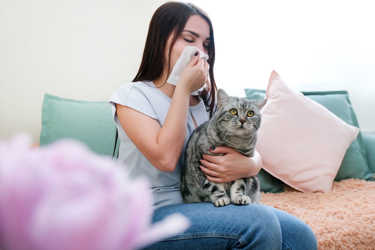 Acupuncture for pet dander and year-round allergies in Boca Raton — woman with her cat, Ronen Rosenblatt Nir, L.Ac.